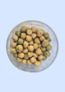 White pea seeds in a glass dish, round and pale cream